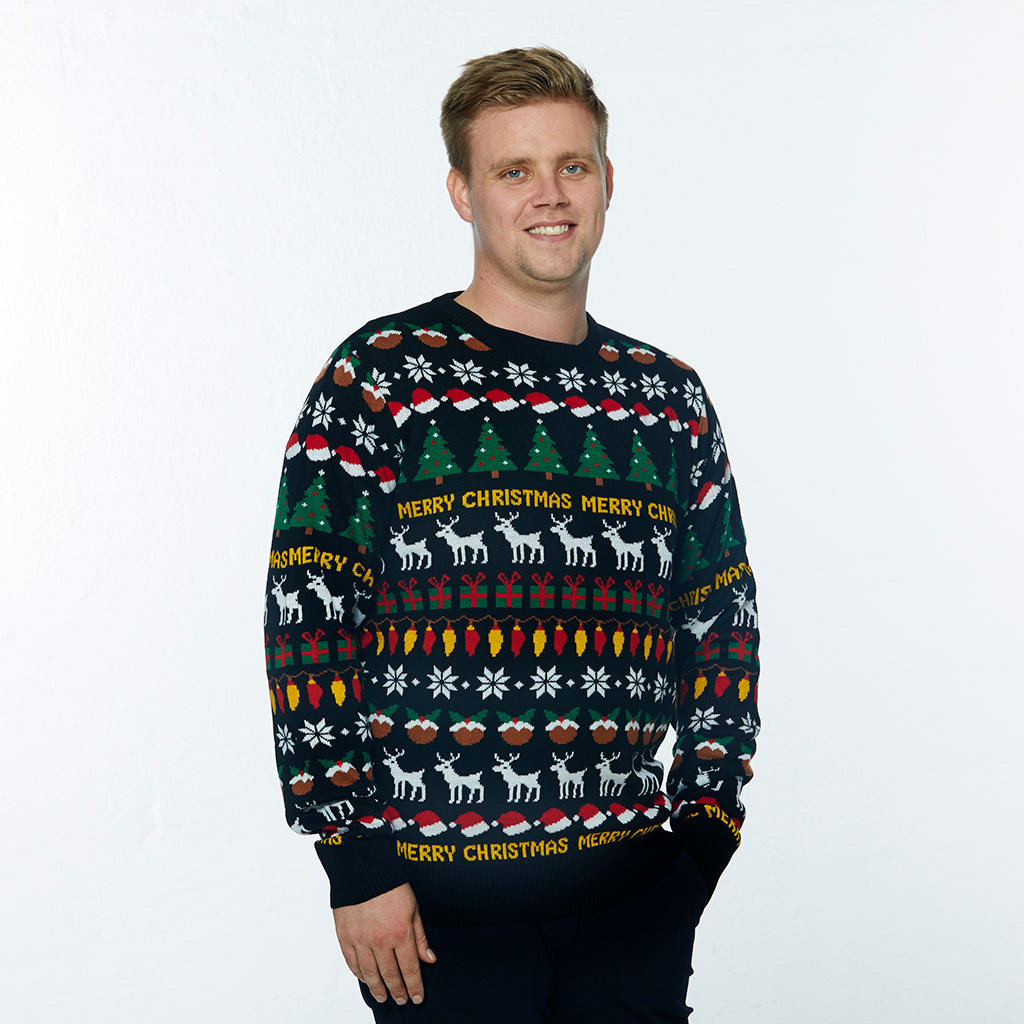 En mand iført en sort julesweater med julemønster.